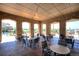Community outdoor patio featuring stone pillars, ample seating, and scenic views at 3181 Firenze Pl, Highlands Ranch, CO 80126