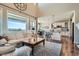 Open living space showcases large windows, hardwood floors, and seamless flow into the kitchen area at 3181 Firenze Pl, Highlands Ranch, CO 80126