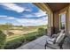 Relaxing patio with comfortable seating overlooking a well-maintained yard and green space at 3181 Firenze Pl, Highlands Ranch, CO 80126