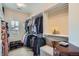 Organized walk-in closet with ample hanging space and natural light from window at 3181 Firenze Pl, Highlands Ranch, CO 80126