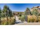 Landscaped walking path featuring stone steps, handrails and views of the community at 3181 Firenze Pl, Highlands Ranch, CO 80126