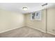 Simple bedroom featuring neutral walls, carpet, and a window at 7065 S Willow St, Centennial, CO 80112