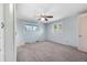 Empty bedroom with soft blue walls, neutral carpet and great natural lighting at 7065 S Willow St, Centennial, CO 80112