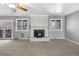The brick fireplace is the focal point of this room and offers a cozy spot to relax at 7065 S Willow St, Centennial, CO 80112