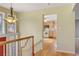 View from the upper level, looking into a light-filled foyer and kitchen at 7065 S Willow St, Centennial, CO 80112