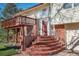 Inviting front entrance with brick steps leading to a bright red front door at 7065 S Willow St, Centennial, CO 80112