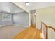 Hallway leading into a room with a large window providing ample natural light at 7065 S Willow St, Centennial, CO 80112