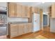 Spacious kitchen featuring ample counter space and a white refrigerator at 7065 S Willow St, Centennial, CO 80112