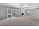 Bright living room with a cozy fireplace and sliding door access to outdoor deck at 7065 S Willow St, Centennial, CO 80112