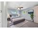 Beautifully decorated main bedroom features a comfortable king bed and mounted television at 7065 S Willow St, Centennial, CO 80112