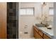 Stylish bathroom with gray tiled shower, marble countertop, and modern fixtures at 6530 W 26Th Ave, Edgewater, CO 80214