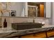 Close-up of bathroom features a stylish gray sink and patterned marble countertop at 6530 W 26Th Ave, Edgewater, CO 80214