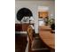 Dining room with wood furnishings and decor leading to a kitchen with wood cabinets at 6530 W 26Th Ave, Edgewater, CO 80214