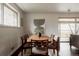 Well-lit dining room with a wood dining table and modern decor touches at 6530 W 26Th Ave, Edgewater, CO 80214