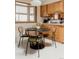 Charming eat-in kitchen with marble table set and bright window, cozy and inviting at 6530 W 26Th Ave, Edgewater, CO 80214