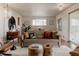 Bright and airy living room featuring stylish furnishings and open layout to the dining area at 6530 W 26Th Ave, Edgewater, CO 80214