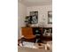 A cozy living room showcasing stylish decor, a mid-century modern chair, and hardwood floors at 6530 W 26Th Ave, Edgewater, CO 80214