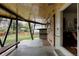 Inviting covered patio with wooden ceiling, outdoor bench, and unique architectural details at 6530 W 26Th Ave, Edgewater, CO 80214