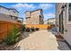 Backyard features a stone patio, new fence, and minimal landscaping at 10123 Zeno St, Commerce City, CO 80022