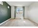 Minimalist bedroom with a large window, neutral walls, and ample natural light for a serene atmosphere at 10123 Zeno St, Commerce City, CO 80022