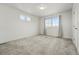Spacious bedroom with large window, neutral decor, and ample natural light creating a serene environment at 10123 Zeno St, Commerce City, CO 80022