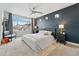 Comfortable bedroom with large window, neutral carpet and dark accent wall at 10123 Zeno St, Commerce City, CO 80022