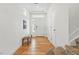 Inviting foyer with natural light, bench seating and hardwood flooring at 10123 Zeno St, Commerce City, CO 80022