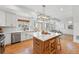 Beautiful kitchen with stainless appliances, island with bar seating and lots of natural light at 10123 Zeno St, Commerce City, CO 80022
