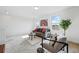 Bright living room with modern furnishings, large windows, and stylish decor for a cozy and inviting atmosphere at 10123 Zeno St, Commerce City, CO 80022