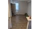 Bright bedroom featuring hardwood floors and a well-lit space at 305 Strong St, Brighton, CO 80601