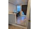 Bonus room showcasing hardwood floors, natural light, and access to the outdoors at 305 Strong St, Brighton, CO 80601
