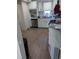 Bright kitchen with white cabinets, stainless steel appliances, and light-colored countertops at 305 Strong St, Brighton, CO 80601