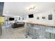 Finished basement with a bar, a TV, and modern decor at 882 E Briarwood Cir, Centennial, CO 80122