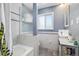Full bathroom featuring a tub and shower and a square basin sink at 882 E Briarwood Cir, Centennial, CO 80122