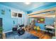 Bright bedroom with a bunk bed, a drum set, and birch tree-themed walls at 882 E Briarwood Cir, Centennial, CO 80122
