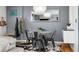 Cozy dining area featuring a modern light fixture, a round table with black chairs at 882 E Briarwood Cir, Centennial, CO 80122