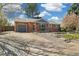Lovely single-Gathering home with stone pathway and spacious driveway leading to attached garage at 882 E Briarwood Cir, Centennial, CO 80122