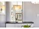 Bright interior view with unique lighting fixture and outside view to backyard at 882 E Briarwood Cir, Centennial, CO 80122