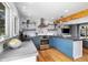 Gourmet kitchen with island, modern appliances, breakfast bar and hardwood floors at 882 E Briarwood Cir, Centennial, CO 80122