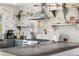 Kitchen with stainless steel appliances, marble backsplash, breakfast bar and modern lighting at 882 E Briarwood Cir, Centennial, CO 80122