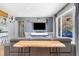 Modern living room with stylish furniture, sleek TV setup, and a large window at 882 E Briarwood Cir, Centennial, CO 80122