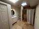 Bathroom featuring stone-tiled shower and floors, plus a lovely vanity at 6838 Harvest Rd, Boulder, CO 80301