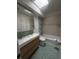 Updated bathroom featuring mosaic tile, modern vanity, bathtub and shower for a spa-like experience at 6838 Harvest Rd, Boulder, CO 80301