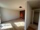 Bedroom with hardwood floors and walls ready for renovation at 6838 Harvest Rd, Boulder, CO 80301
