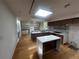 Bright, updated kitchen with white countertop island, modern cabinetry, and new appliances for a contemporary feel at 6838 Harvest Rd, Boulder, CO 80301