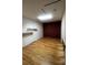 Versatile room with hardwood floors, built-in shelves, and skylight, perfect for a home office or guest room at 6838 Harvest Rd, Boulder, CO 80301