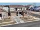 Expansive two-story home featuring a welcoming front porch and a spacious driveway at 14667 Crouch Pl, Parker, CO 80134