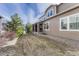 Lawn with a covered patio, offering ample space for outdoor activities and entertainment at 14667 Crouch Pl, Parker, CO 80134