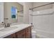 Bathroom featuring a vanity with a white countertop and a tiled shower-bathtub combination at 14667 Crouch Pl, Parker, CO 80134