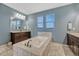 A main bathroom with large soaking tub surrounded with decorative tile, double sinks and tile flooring at 14667 Crouch Pl, Parker, CO 80134